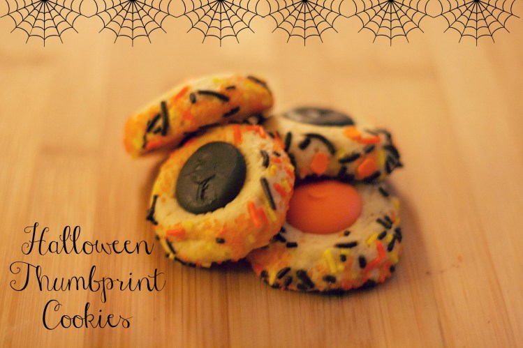 orange and black halloween thumbprint cookies, simply social blog 